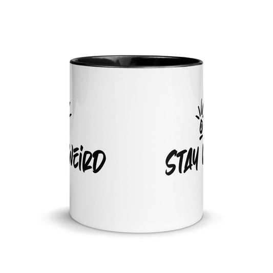 Quirky 'Stay Weird' coffee mug filled with steaming beverage, ideal for those who revel in their uniqueness every day.
