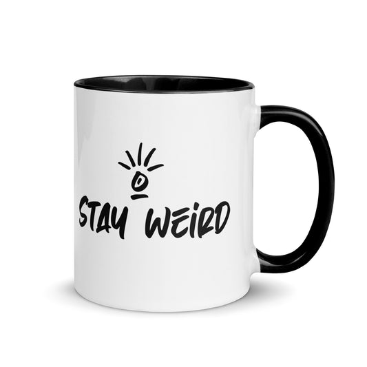 Quirky 'Stay Weird' coffee mug filled with steaming beverage, ideal for those who revel in their uniqueness every day.